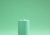 Green battery on green background